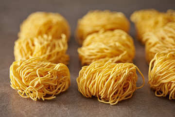 Dried Homemade Pasta Noodles on Gray Background
