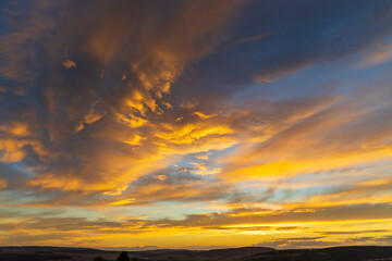 sunset in late summer with colorful clouds