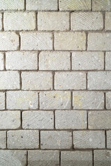 wall built of stone blocks of tuff