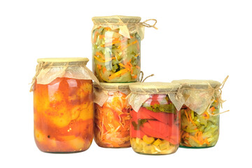 Variety glass jars of homemade pickled or fermented  colorful vegetables isolated on white...