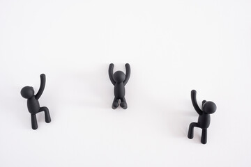 three black 3D puppets climbing over a white background, 3d people, human character , person...