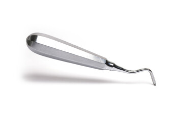 angled dental tool levering teeth white background