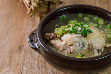 Samgyetang, Korean Ginseng Chicken Soup : Tender, whole, young chicken stuffed with ginseng, jujubes, sweet rice, and whole garlic cloves and simmered until tender. The combination of chicken and gins