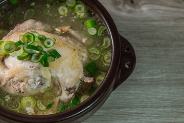 Samgyetang, Korean Ginseng Chicken Soup : Tender, whole, young chicken stuffed with ginseng, jujubes, sweet rice, and whole garlic cloves and simmered until tender. The combination of chicken and gins