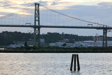 The bridge connects Halifax and Dartmouth, Nova Scotia. This is in the early evening.