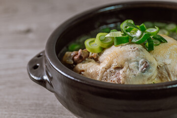 Samgyetang, Korean Ginseng Chicken Soup : Tender, whole, young chicken stuffed with ginseng, jujubes, sweet rice, and whole garlic cloves and simmered until tender. The combination of chicken and gins