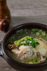 Samgyetang, Korean Ginseng Chicken Soup : Tender, whole, young chicken stuffed with ginseng, jujubes, sweet rice, and whole garlic cloves and simmered until tender. The combination of chicken and gins