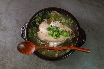 Samgyetang, Korean Ginseng Chicken Soup : Tender, whole, young chicken stuffed with ginseng, jujubes, sweet rice, and whole garlic cloves and simmered until tender. The combination of chicken and gins