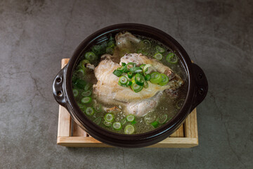 Samgyetang, Korean Ginseng Chicken Soup : Tender, whole, young chicken stuffed with ginseng, jujubes, sweet rice, and whole garlic cloves and simmered until tender. The combination of chicken and gins