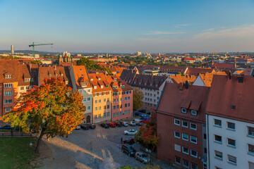 Fototapeta na wymiar Top cityscape view from the castle hill on the old town with cathedral in Nurnberg during the morning, Germany