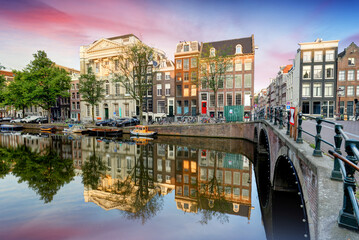 Fototapeta premium Amsterdam Canal houses at sunset reflections, Netherlands