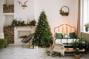 Fototapeta na wymiar Christmas decor, beautifully decorated living room with fireplace and firewood