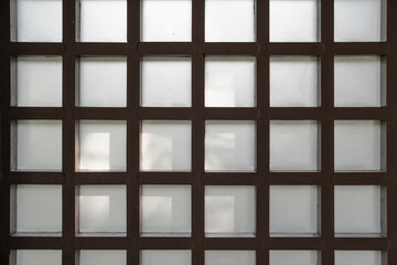 Close up of glass blocks wall allowing light to enter building interior.