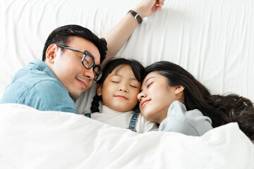 small asian family portrait at home