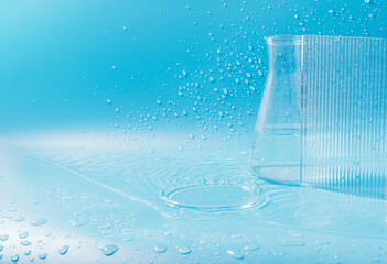 Empty podium with glass labware, flask bowl platform. Research and development of cosmetics in the...