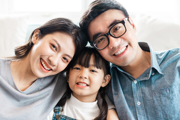 small asian family portrait at home