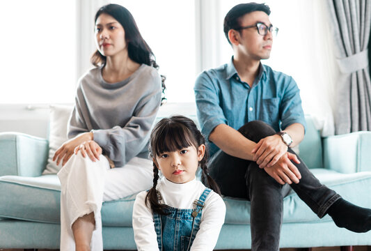 Small Asian Family Portrait At Home