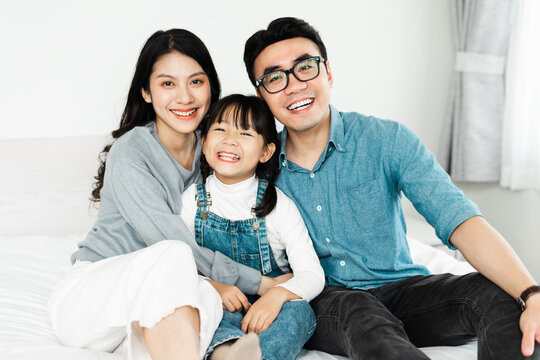 small asian family portrait at home