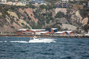 Fototapeta na wymiar An Ocean Yacht Near Dana Point with the Marine Science Center in the Background