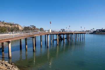 Fototapeta premium The Dana Point, California, Harbor Looking at the Public Recreational Wooden Pier on the South Bay