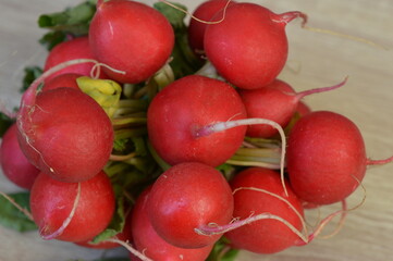 radishes on a wooden background, very healthy vegetables