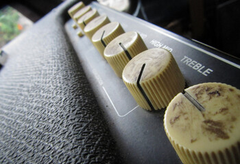 detail of bass amplifier, you can see the knobs are dirty, sound system.