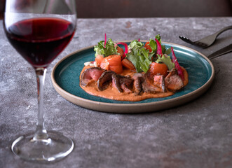 fillet and fresh vegetable salad of lettuce, arugula, spinach, cucumber and tomato. Healthy lunch menu.