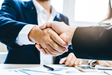group of successful business people meeting. client and suppliers shaking hands after deal agreement completed. - obrazy, fototapety, plakaty