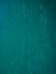 Abstract colored background of green paint on the wall.