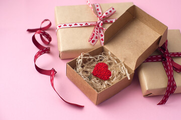 box with red heart on pink background. valentine's day concept, gift for 8 march, congratulations on mother's day