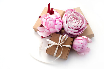 gift boxes, beautiful pink peonies on a white background. congratulations on Valentine's Day, mother's day, birthday. romantic background