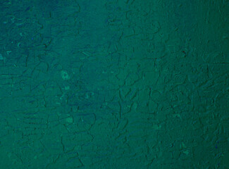 Abstract colored background of green paint on the wall.
