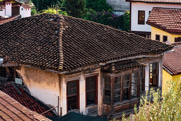 view of the tiled roofs of ancient houses in the historical center of Antalya, Turkey