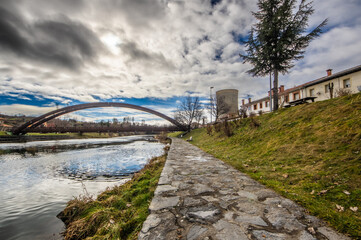 Views of the Carrion river as it passes through Velilla del Rio Carrion (Palencia), with the now demolished cooling tower of the thermal power plant