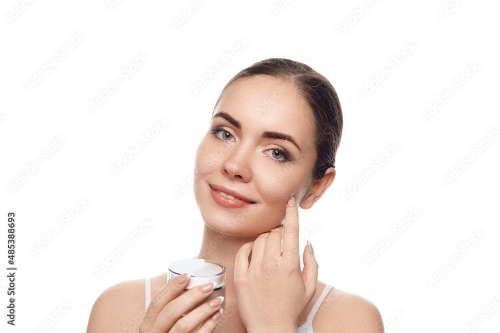 Canvas Prints beauty concept. woman holds a moisturizer cream, face skin. body care, skincare.