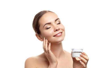 Beautiful Woman with moisturizing cream . clean skin. Skin Care. Cosmetics. Facial treatment. Cosmetology, beauty and spa