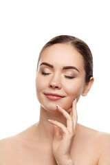 Fototapeta premium Beautiful Young Woman with Clean Fresh Skin touch own face . Facial treatment. Beauty and spa . Skin Care. Cosmetics.