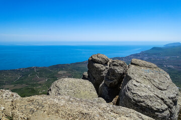 View of the Black Sea and stone conglomerates from the top of the Demerdzhi mountain range in Crimea.