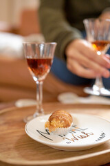 person holding a glass of wine