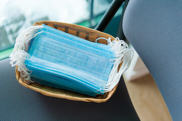 medical sterile masks are in a basket in a pile