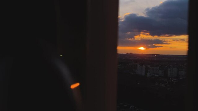 Dark view of simple sunset through flat window.