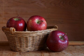 Background with red apples in basket