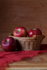 Background with red apples in basket