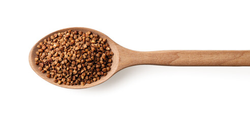 Wooden spoon full of dry wholegrain buckwheat groats isolated on a white background. Concepts of gluten free diet and dietary fiber. Roasted buckwheat grains for healthy vegetarian food.