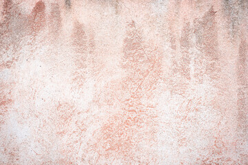 Pink, purple and peachy wall texture background. Pastel tones. Beautiful, stylish, tender and colorful backdrop. Bright stone structure covered with stucco and paint. Close up, copy space