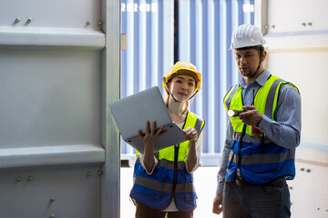 Foreman or worker work at Container cargo site check up goods in container. Foreman or worker checking on shipping containers. Logistics and shipping