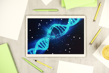 Creative light DNA illustration on modern digital tablet display, science and biology concept. Top view. 3D Rendering