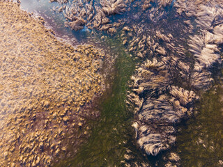 Abstract aerial drone view with wet green field