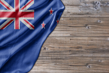 Wooden pattern old nature table board with New Zealand flag - 485401270