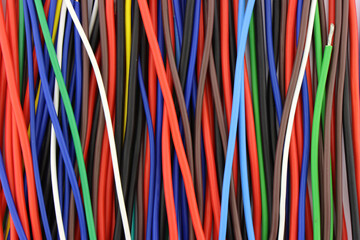Copper mounting electrical wires in color insulation close-up. 